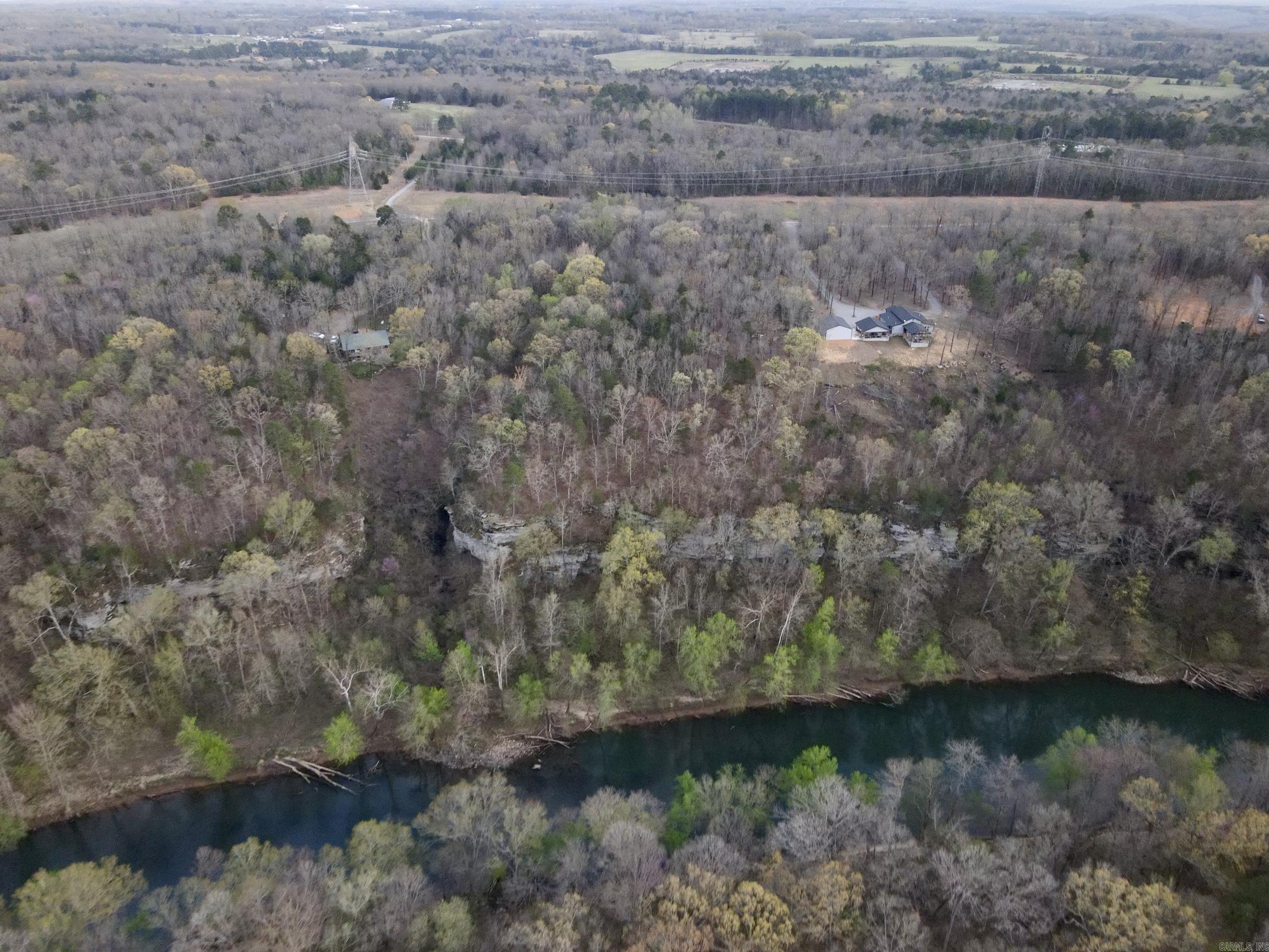 Love world-class fishing, stunning views, and peaceful surroundings? This oneās for you! Nestled in a gated community with underground utilities, this bluffside lot offers jaw-dropping views of the Ozark Mountains and the Little Red River. Imagine sipping your morning coffee while overlooking this gorgeous landscape! The land features a mix of white oak, red oak, hickory, and cedar trees, plus plenty of friendly wildlife to enjoy. With paved road access and multiple building spots (though you'll likely want to claim that bluffside setting), this is the perfect place to bring your dream home to life.