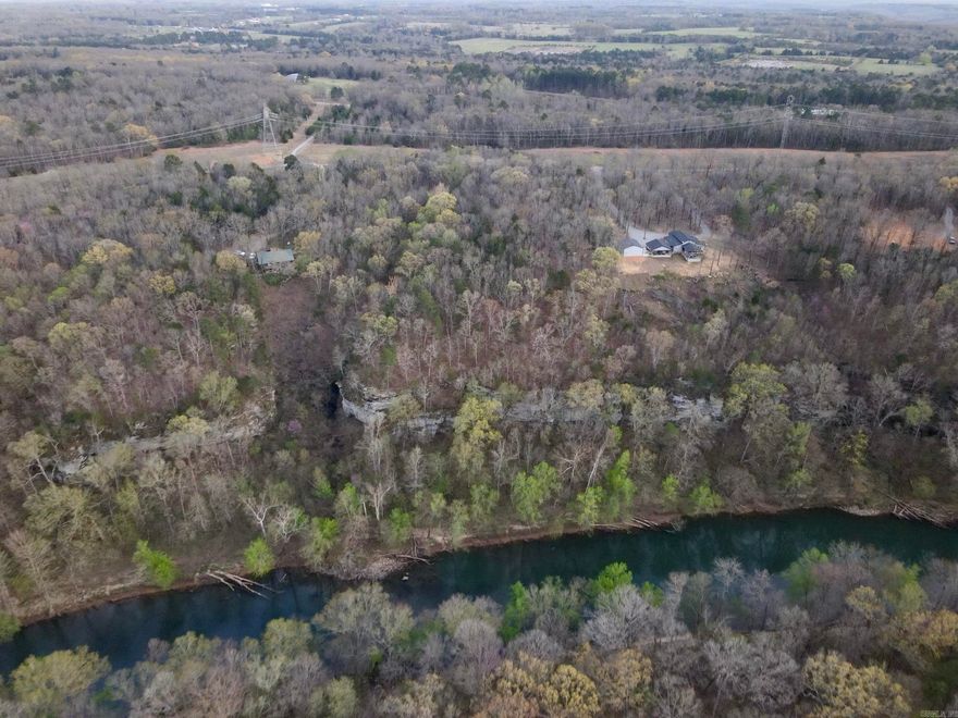 Love world-class fishing, stunning views, and peaceful surroundings? This one’s for you! Nestled in a gated community with underground utilities, this bluffside lot offers jaw-dropping views of the Ozark Mountains and the Little Red River. Imagine sipping your morning coffee while overlooking this gorgeous landscape! The land features a mix of white oak, red oak, hickory, and cedar trees, plus plenty of friendly wildlife to enjoy. With paved road access and multiple building spots (though you'll likely want to claim that bluffside setting), this is the perfect place to bring your dream home to life.
