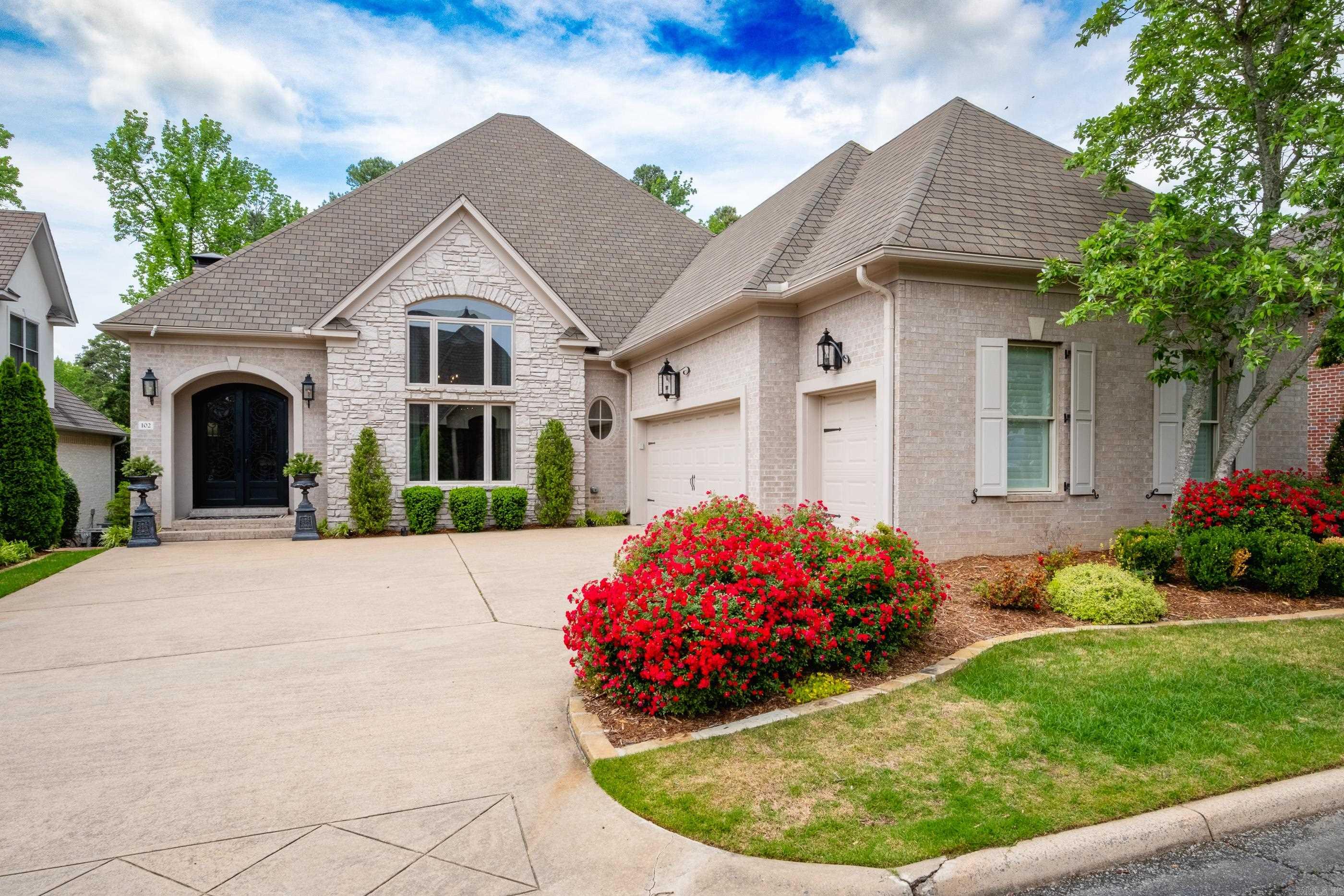 Beautiful home in the desirable gated neighborhood, The OAKS in Chenal. Hardwood floors throughout the downstairs. Newly updated kitchen and master bathroom. Walk through the gorgeous iron doors into a foyer with vaulted ceilings. The large windows in the dining and living room let in the beautiful natural light. Step outside to a peaceful patio area with a large backyard. Protected green space behind the home gives a private feel yet Chenal Country Club is just a short walk or golf cart ride away. The master has a brand-new spa like bathroom with a large walk-in closet. The kitchen has quarts countertops and an island for entertaining. Under mount electrical and lit cabinets. Downstairs has a built-in bar, office space, large laundry room, Upstairs has 2 large bedrooms and 1 large bathroom, seating space and a theater room.