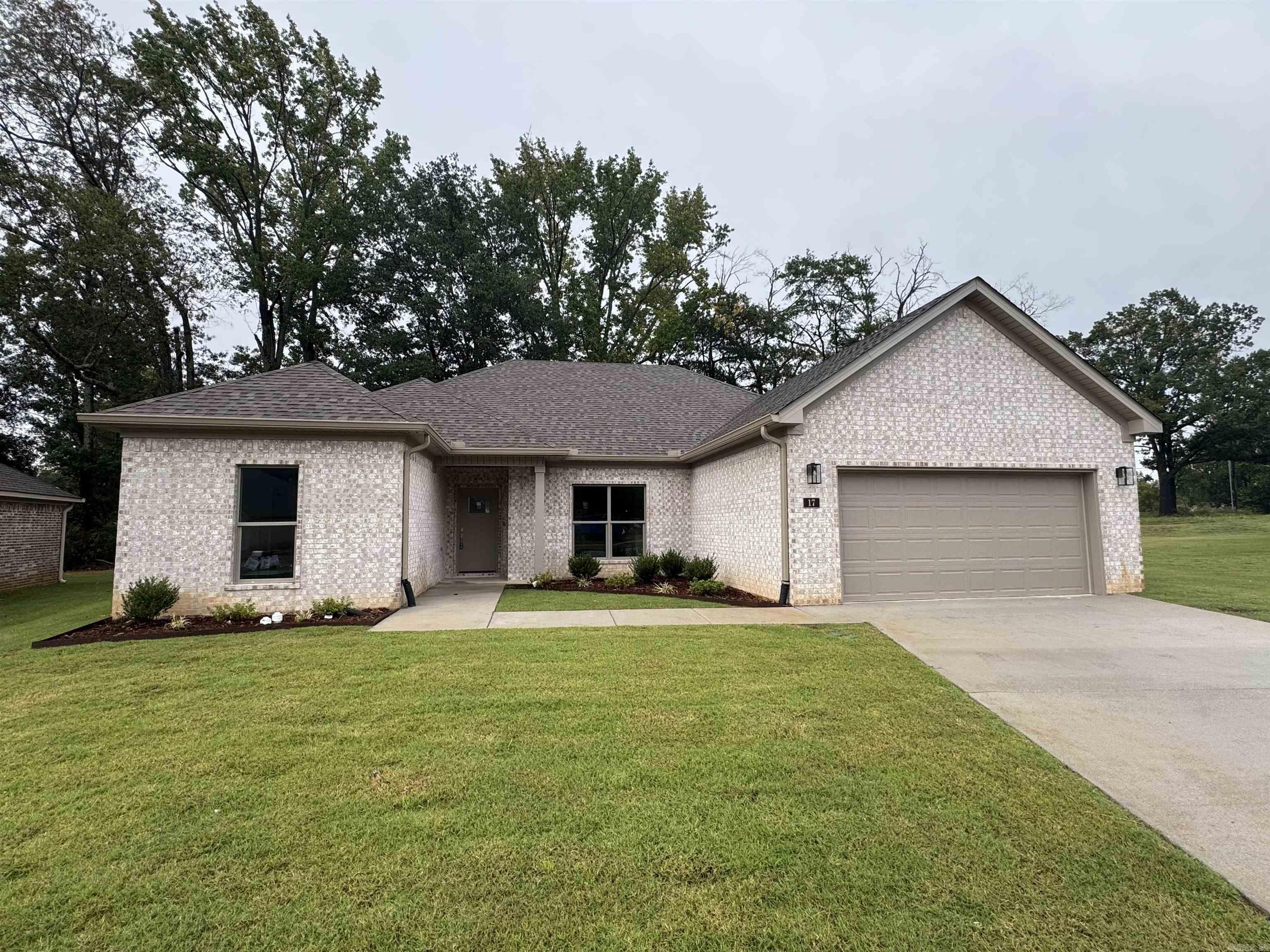 Welcome to Carmel Oaks, one of Cabot's newest communities, only 12 miles from the Little Rock Air Force Base. This NEW construction floor plan offers 3-bedrooms and 2-bathrooms. As you enter, youāre greeted by tall ceilings, a cozy fireplace, crown molding, and an open floor plan that seamlessly connects the living, dining, and kitchen areas. The MASSIVE living area features natural light and a seamless flow into the designated dining area with a great view of the covered back patio! This home utilizes SOLAR board roof decking for energy efficiency. Other features include: floored attic space for ample storage, 42" custom kitchen cabinet upgrades, granite countertops, custom kitchen pantry with a receptacle for your coffee station, LVP flooring, tiled shower in the master bathroom, comfort height toilets, large custom walk-in master closet, 50 gallon water heater, recessed lighting AND ceiling fans, elegant finishes and neutral tones to enhance versatility. This property is also equipped with an irrigation system. Located in highly sought after Cabot School District. Several new-homes and floor plans to choose from! (Photos may not show exact finishes of this address.)