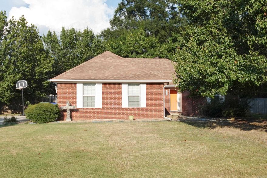 Very well maintained 2 owner home on large lot with plenty of privacy and parking! 3BR/2BA split floor plan.  Primary BR is large with walk-in closet. Open floor plan with large living area. Separate laundry room. Only carpet in house is in 2 BR's, rest is tile and laminate.  New dishwasher in 2023. Refrigerator conveys. New garbage disposal in 2024. HVAC has a maintenance contract - cleaned and serviced twice per year. 2025 new Motor (outside) and 2024 Blower (inside).  New water heater in 2012. Roof was replaced approx. 2017. Every exterior door (3) has a storm door to let in all the sunshine! Out back is a fabulous 15 x 20 covered wood deck.  Enjoy cool nights or coffee in the morning in your private backyard. House sits well off the road and has a double driveway for ample parking.  Side entry 2 car garage.