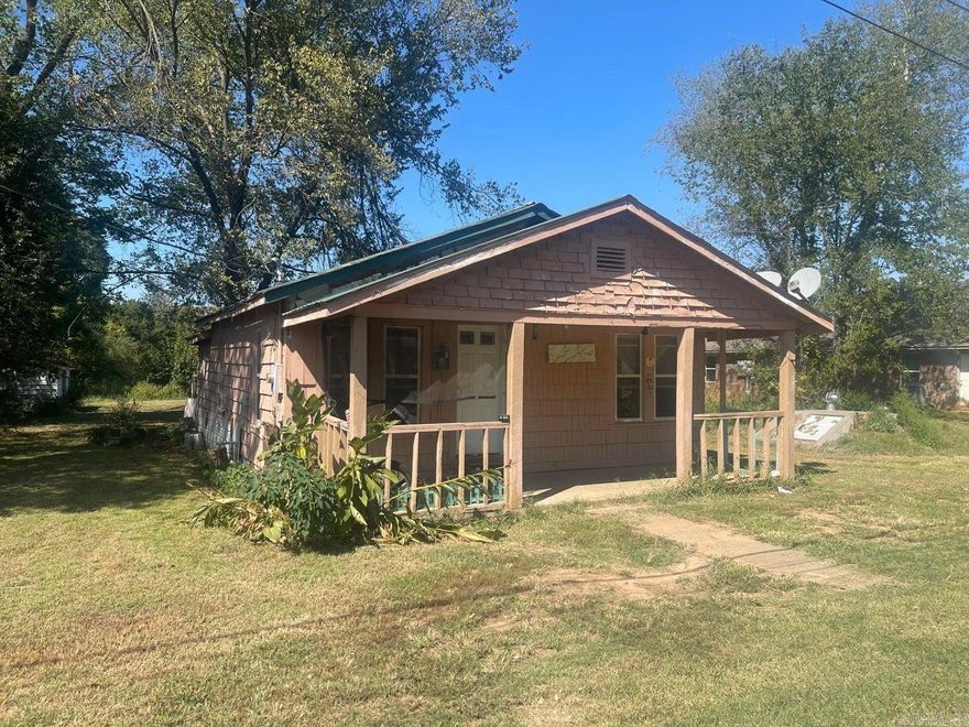 Cute cottage is quite charming and offers a huge yard! Wonderfully convenient location! Kitchen appliances convey. New kitchen flooring, bathroom flooring, bathroom vanity. Surprisingly larger inside than it appears from the exterior. Newer windows, lots of closets! Storm shelter. Owner will consider leaving the washer and dryer if offer is reasonable.