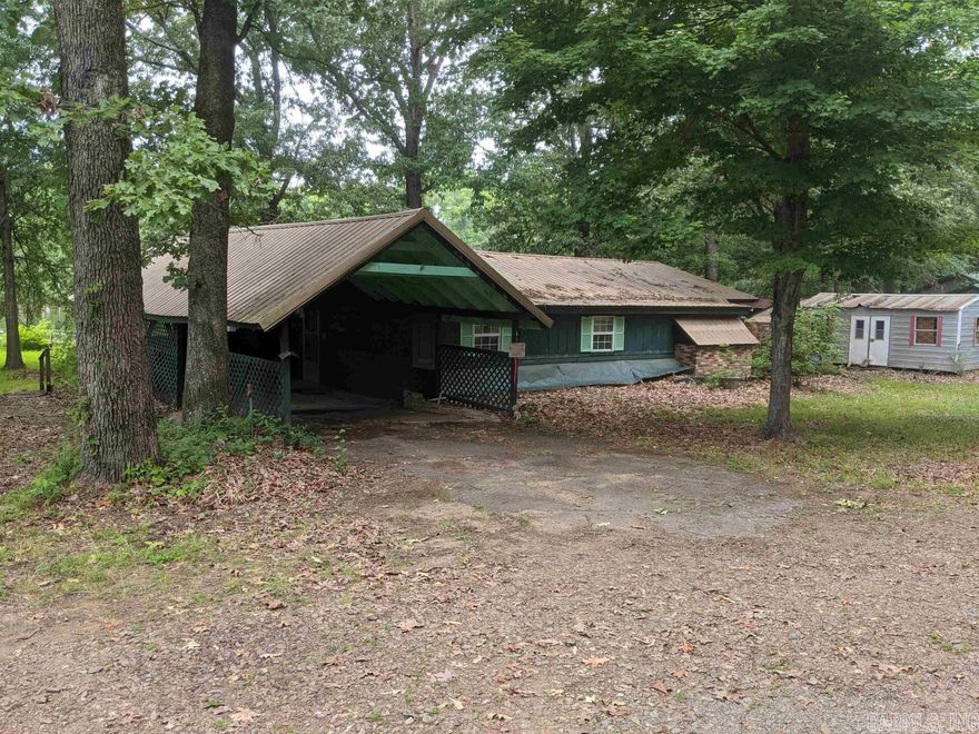 This is a home with approximately 202 feet of lake front.  Home does need some maintenance.  A lot of the wood decks need replaced along with the boat dock.  Interior has low 7 foot ceilings typical for its age.  Large sunroom that is on pier and beam floors while rest of home is on concrete slab.  Adjacent building is a storage building with a full bath and small kitchenette and screened enclosed porch.  Absolutely NO Trespassing must have Realtor present.  Neighborhood Crime Watch will call 911!