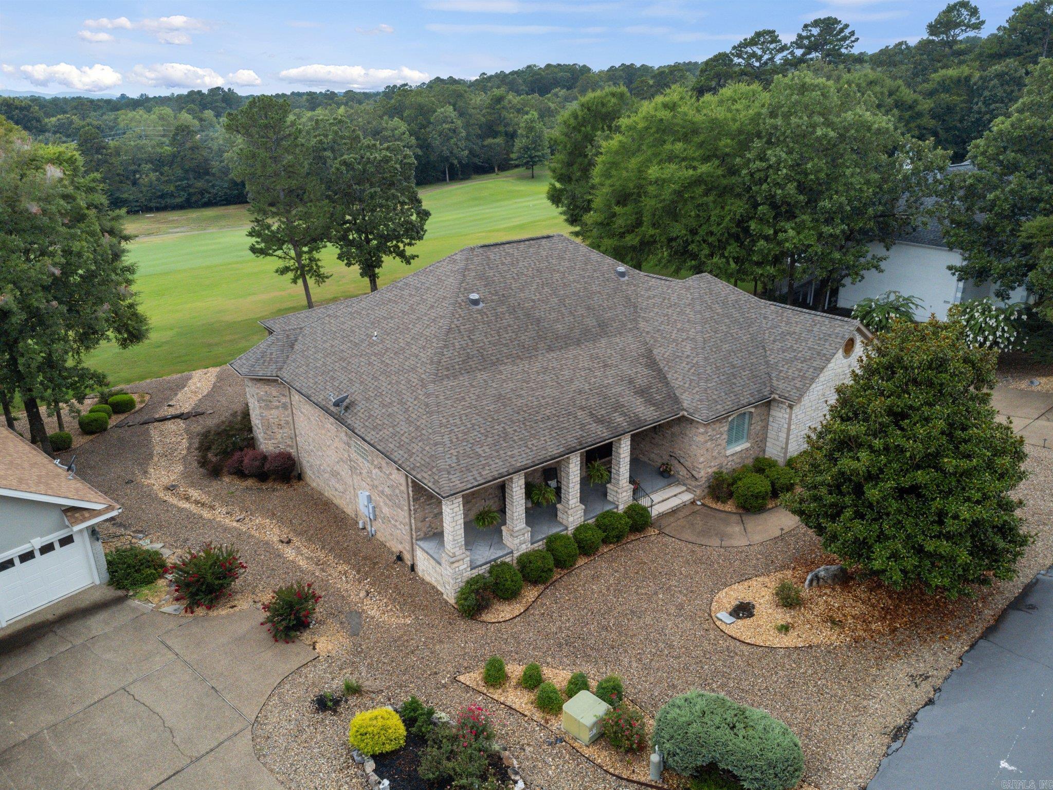 This incredible home is located in Diamante, the only private country club in Hot Springs Village. Move-in ready, one level home, featuring a chef's kitchen that includes a 48" Viking gas cooktop, volume ceilings, fireplace, beautiful hardwood floors, a wet bar, and a spectacular sunroom. The primary suite is spacious, comfortable and functional! A buried propane tank, two HVAC units installed 2019, water heaters installed in 2018 and 2022, roof in 2018. Best of all are the gorgeous views of Diamante #13 green from the sunroom and deck. Don't miss a chance to live out your dream in Hot Springs Village, showcasing the best of Arkansas' natural beauty in North America's largest gated community. Agents see remarks!