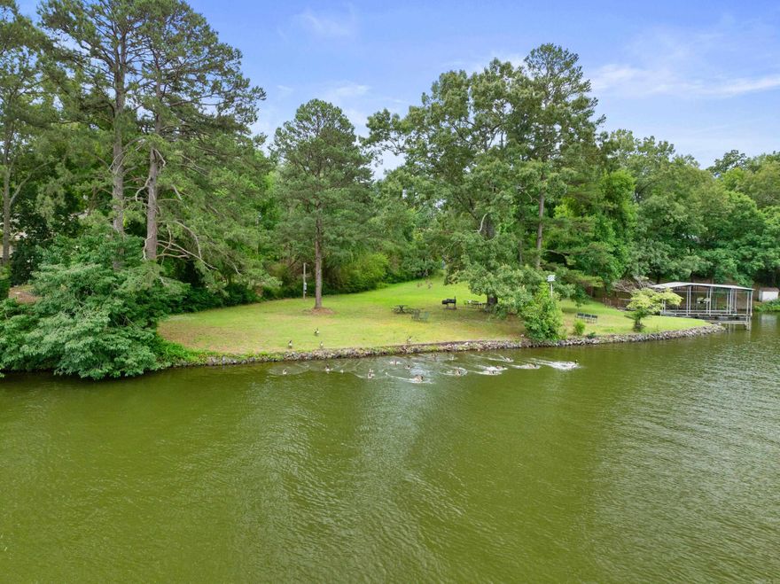 Rare Opportunity for this +80-year-old homestead with lakefront ACREAGE! A full 3.66-acres just off the main channel of LAKE HAMILTON. With a total of 463 FRONT FEET on the lake, your options to build that home you’ve been yearning for are nigh-on endless. Located in the desirable area of Sparling Road off Morphew and across from Stonegate Shores. Submerge yourself in its natural beauty as you escape the world's troubles. This central location offers the perfect balance of convenience and privacy, putting you minutes to town. Beautiful views of the lake and West Mountain. This expansive parcel (3 deep lots in total)* gently slopes down to the lake, providing easy access to the wide-open cove and on-site boat ramp. Avoiding the bustle of the main channel, the cove's no-wake zone offers an inviting serenity. Don’t miss this opportunity to turn your lake-living dreams into a reality! Lake Hamilton school district. See Agent Remarks for Showing Info. **Seller will consider selling Lots 1 & 2 together by themselves - 361.85 Front Feet, 2.48 acres.