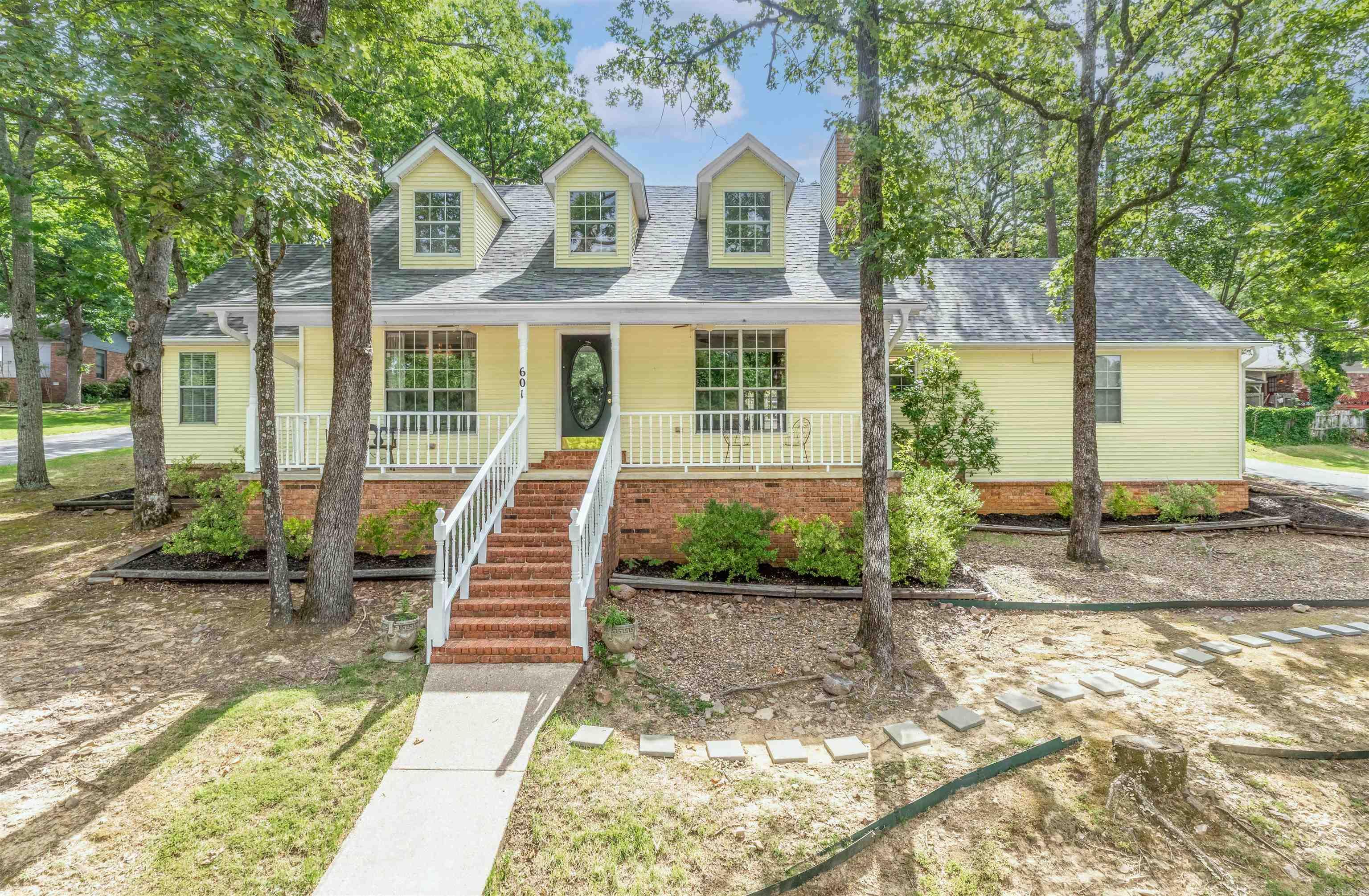 Welcome to this charming home nestled in a quiet, tree lined community. This 3-bedroom, 2 full bath home is rich with character—from classic finishes inside to inviting outdoor living spaces. Step inside to a large living area with vaulted ceilings and beautiful natural light along with French doors leading to a covered back patio. The generously sized master suite featuring a private bath offers a peaceful oasis. The third bedroom currently serves as a sophisticated formal dining room but can easily be reverted back to a bedroom to suit your needs. Residents enjoy access to the community pool nearby, as well as being within minutes of shopping and dining.