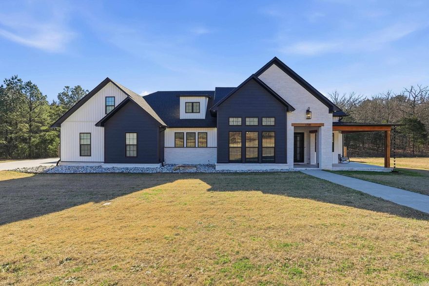 Located in the exclusive gated Hidden Valley Subdivision, this stunning 2022 custom-built home is filled with luxury features throughout. You’ll love the seamless indoor & outdoor living of this thoughtfully designed property. Offering 3 bedrooms, 2 full baths, 2 half baths, an office, and a bonus room, there’s plenty of space for all your needs. Open-concept layout features spacious rooms designed for entertaining. The chef’s kitchen includes an oversized 6-burner gas cooktop w/ griddle and double oven, double pull out dishwasher & refrigerator that conveys. The living room is warm & inviting with 11ft ceilings & gas-log fireplace. All bedrooms are conveniently on the main floor, bonus & half bath create a great flex space. The primary suite boasts dual vanities, a soaking tub, oversized shower, & a generous walk-in closet. Step outside to an entertainer’s dream: a large screened-in patio complete w/ a wood-burning fireplace, built-in BBQ grill & sink for effortless year-round outdoor cooking & enjoyment. Additional features include a tankless water heater, 14x28 in-ground saltwater pool, 3-car garage, and a safe room. If you’re looking for luxury and privacy this is it!