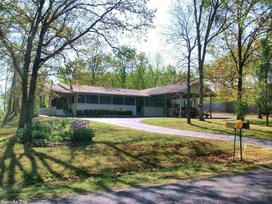 Beautiful Setting!! Large 4Br. 3.5Ba. Manufactured Home sitting on 2.08 ac.  with large shop and storage building. Features include paved driveway, lg. decks, screened in porch, beautiful flowering plants and trees and more.  Great location just off of Hwy 270 E. Magnet Cove Schools.