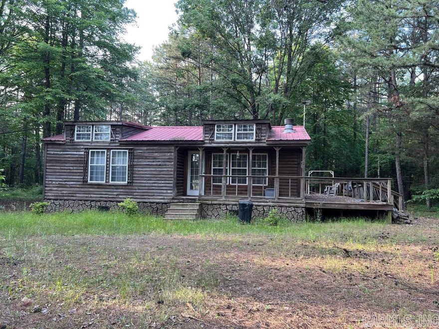 Small Cabin in the Pines, Priced right to sell  2 bedroom 1 bath with additional loft big enough for a bed Wrap around Deck Lots of Pine trees make this 2.5 acres feel secluded and peaceful