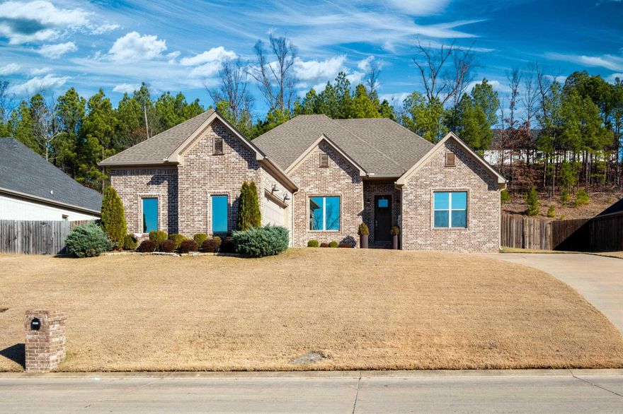 Welcome to this beautifully appointed 4-bedroom, 2-bath home in a truly gated community! Offering the perfect blend of modern convenience and serene privacy. Situated in Lochridge Estates gated community just minutes from shopping and dining and amenities, this home provides a tranquil retreat without sacrificing accessibility. As you step inside, you’ll immediately notice the expansive, open floor plan, designed for seamless entertaining.   The large living area flows effortlessly into the gourmet kitchen, complete with high-end finishes and ample space for hosting guests or enjoying quality time. The elegant dining area is positioned perfectly for gatherings, all while maintaining an inviting, spacious feel. The luxurious master suite is a true retreat, featuring a generous layout and a spa-like ensuite bath. Connecting to the primary suite is a thoughtfully designed laundry room, offering convenience and privacy.   Each bedroom is outfitted with custom-made plantation shutters. The home boasts numerous thoughtful details, including a mudroom, gas fireplace, high ceilings, wooden style beams, and an open concept feel! There's nothing this home is missing so come take a tour today