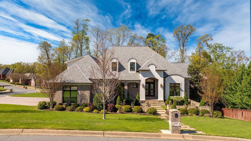 This exceptional custom-built Martin Signature Home is a showcase of superior craftsmanship & design. From the elegant barrel-entry ceiling foyer, unparalleled attention to detail in an open living concept, gorgeous hickory wood floors throughout create a warm & inviting atmosphere. The soaring high ceilings & exposed beams add architectural drama, w/windows filled w/natural light throughout. The linear granite accent wall fireplace & elegant glass shelving opens to the dining area for a sophisticated space. For the culinary enthusiast, the chef’s kitchen includes a copper farm sink, expansive granite island, & professional-grade gas cooktop—perfect for preparing gourmet meals in this functional & beautiful kitchen. The tranquil primary suite offers a cozy sitting area, luxurious spa bath & spacious closets. The versatile floor plan features FOUR generously sized ensuite bedrooms/baths AND thoughtful bonus room w/ bath upstairs offers flexibility. The stone-enclosed courtyard, porch & cozy screened veranda provide a private oasis & the utility/laundry room, ensuring practicality. Add the innovative offices, flex rooms & tons of storage makes this a showstopper! See Agent Remarks!