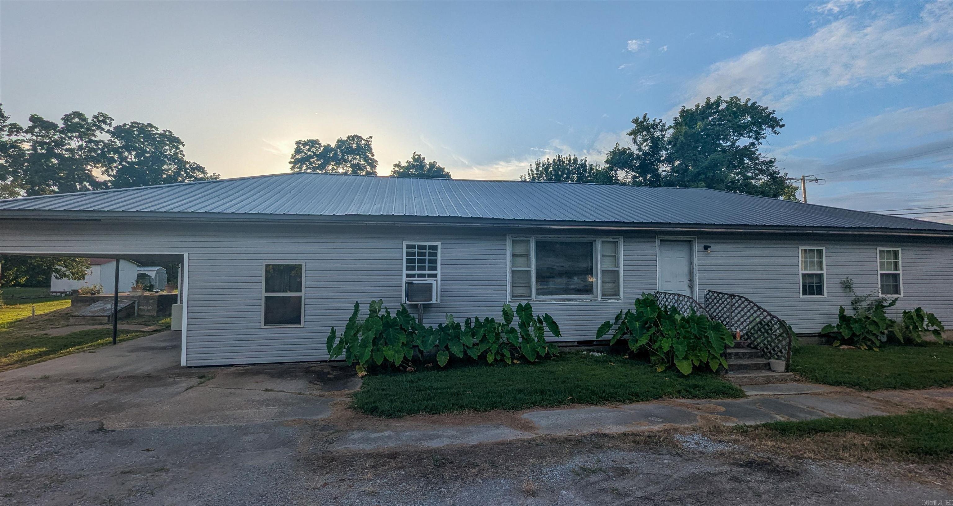 This spacious 4-bedroom, 2-bath home offers nearly 1,900 square feet of comfortable living with major updates already completedāmaking it a great value. Key improvements include updated electrical and water lines (2015), new windows (2018), metal roof (2022), new siding and attic insulation (2017), and an enclosed second carport converted into a bonus room (2017). The home is equipped with window units for cooling and a gas wall heater for heat. Though it does not have central HVAC, the property has solid structure and potential, making it ideal for buyers seeking space with room to customize. Home is being sold as-is. Remember don't buy or sell alone.
