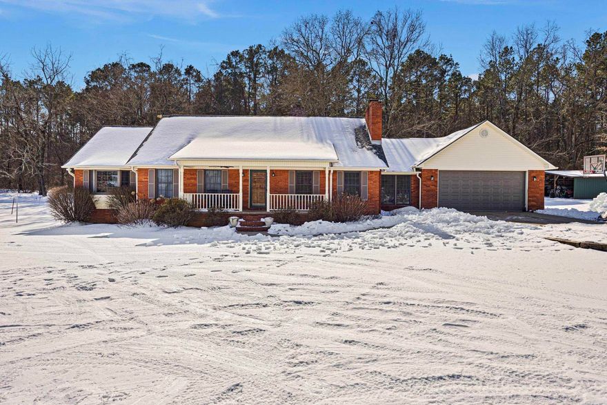 Some homes are built to sell… this one was built to last.  Tucked onto 2.5 private acres, this 2,100+ sq ft home gives you that rare feeling of breathing room the moment you pull in the drive. It has the kind of construction you don’t see much anymore — true 6-inch exterior walls, real wood windows, and a genuine wood-burning fireplace capable of heating the whole house.  The heart of the home is the newly remodeled kitchen with granite countertops, where the sink looks out over a quiet backyard instead of another house. Mornings feel slower here. Evenings feel calmer.  An oversized mudroom keeps real life organized, the home is completely move-in ready, and the front porch is just waiting on a couple of chairs and a cup of coffee.  It’s the kind of solid, comfortable home that’s getting harder to find — space, land, and quality all in one place.