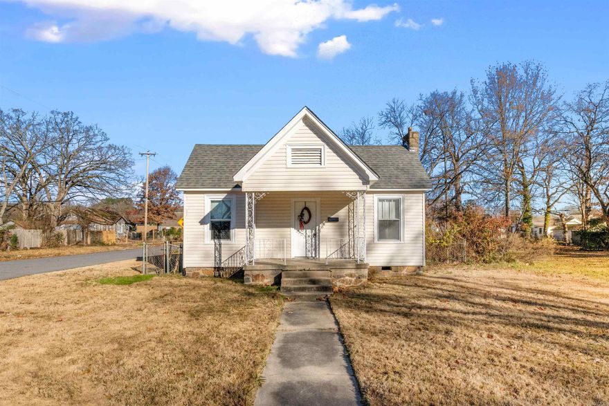This adorable two bedroom, one bathroom home in downtown North Little Rock has all of the charm and character! The front porch invites you inside to a lovely living room with fireplace! Step through an ached double doorway into a darling dining room with two built in cabinets with glass front doors! The hardwood flooring in the living room, dining room and two bedrooms have maintained their charm! The kitchen in this home has TONS of storage. On the back of the home you will find a bonus room that can be used as a second living room OR a third bedroom as it has a large closet! Concrete has been thoughtfully added in the back for multiple parking options or even a space to add an outdoor entertaining area. You can also enjoy the covered back patio! Many updates throughout the home! All of this is situated on a corner lot! Book your private showing today!