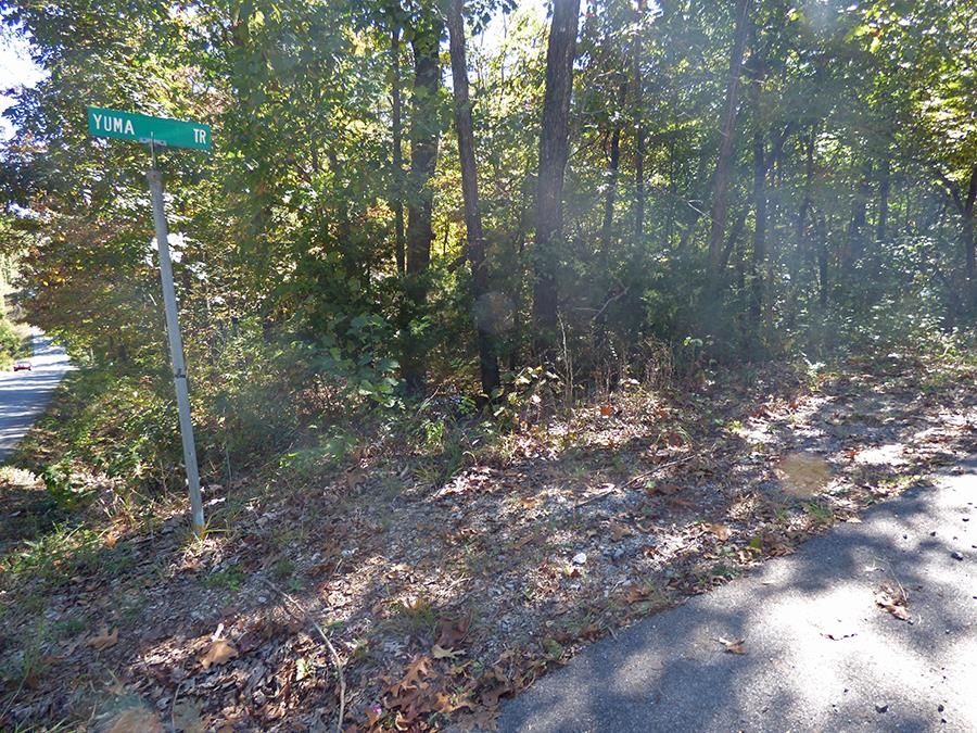 Unimproved residential lot located close to US highway 62-412. This wooded lot is on the corner of Yuma Trail & Pontiac Drive. Ownership gives you access to all of the Cherokee Village amenities; 7 lakes and 2 great rivers for fishing, boating, canoeing/kayaking, and swimming, 2 championship golf courses, several nature walking trails, recreation centers, numerous parks, near historic downtown Hardy.