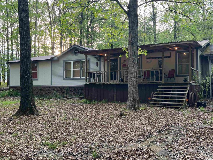 This home is country living at its best! 7 miles from town! 2 additional acres also available. Screened in large back porch, covered parking , creek in front yard and so much more to offer!
