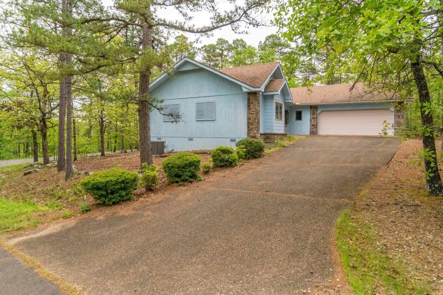 Attn Bargain Hunters! This home is light and bright with amazing windows throughout. A split floorplan with a spacious primary bed and bath. A large kitchen with solid wood cabinets, open to the dining and living room. Seasonal lake views from most rooms and your deck.  Many repairs have already been made including all new appliances in the kitchen. Ready for you to add those cosmetic touches and call it home. Agents see remarks