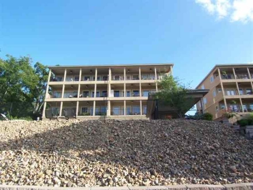 LOCATION!! LOCATION!! LOCATION!! 3rd floor condo with elevator! Granite countertops, stainless appliances, crown moulding and ceramic tile in an open floor plan. Hardwood floors in master bedroom, customized closets and many other features. Partial lake views and fireworks from patio. Boat tie-up on pier. Agent is related to seller.