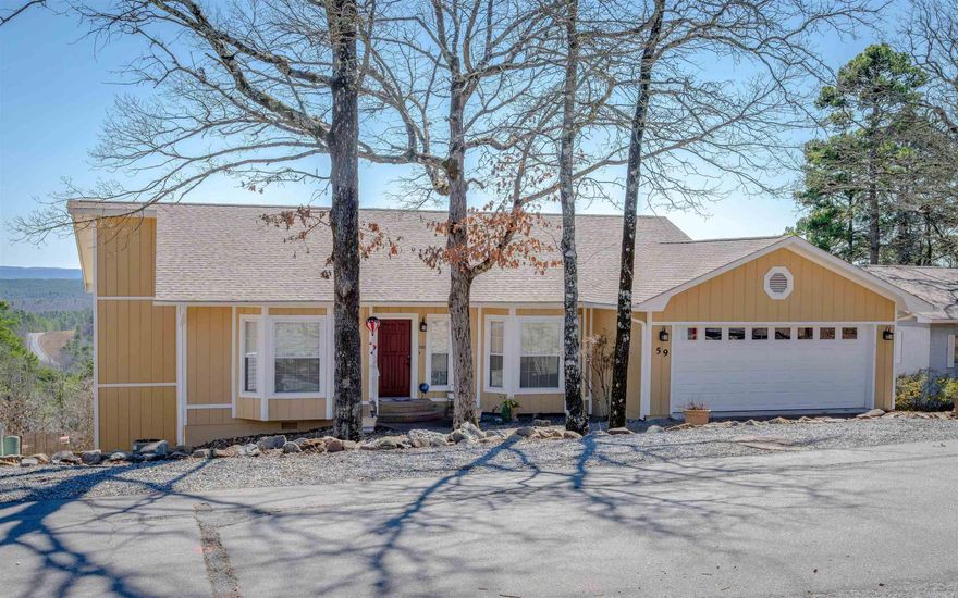 Discover breathtaking vista views and meticulously updated comfort in this exceptionally maintained home!  Solar Panels provide average monthly electric bill of $15. Step inside to an inviting open floor plan on the main level, featuring a spacious living area seamlessly connected to the kitchen, dining room, and breakfast nook. The vaulted ceiling in the living room enhances the airy and bright atmosphere. Two   bedrooms and two full bathrooms on this level provide convenient single-level living. The lower level offers a versatile family room, third bedroom, and third full bathroom, ideal for guests. A workshop space with exterior access provides ample room for hobbies or storage. Enjoy outdoor living on the full-size deck off the main level, perfect for entertaining or relaxing while taking in the expansive mountain views. The lower level also features a covered patio, extending your outdoor enjoyment. The fenced backyard features grass, a concrete walkway, and rock landscaping. Updates: 2024 roof & solar service; 2023 landscaping, fence, sprinklers; 2022 exterior paint, storage, solar, garage floor; 2021 interior paint, appliances, fixtures, LED lighting.