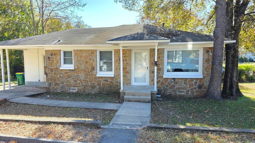 Welcome Home.  This corner lot house has been well taken care of. The house has two bedrooms and one bathroom.  The large kitchen has new backsplash, countertops, and flooring. New windows and interior paint allows all the sun to come in.  Carport with added parking spots mean you will have enough parking for the family this holiday season. Square footage is approx.  Please measure.