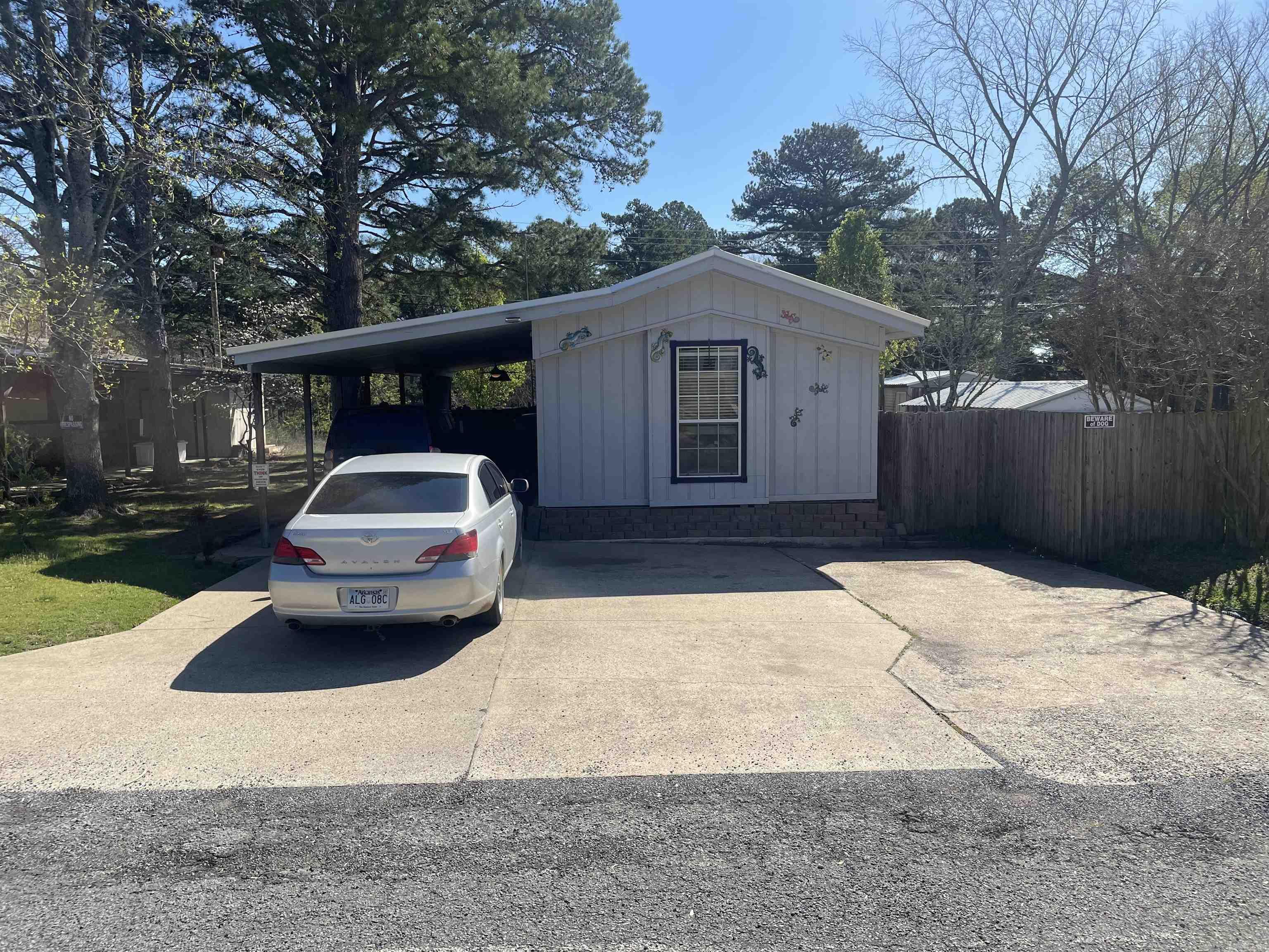 Located in Fairfield Bay this property sits on two lots. It has 3 outside storage buildings and a covered detached parking area in the oversized back yard. Close to Fairfield Bay Marina. SEE AGENT REMARKS