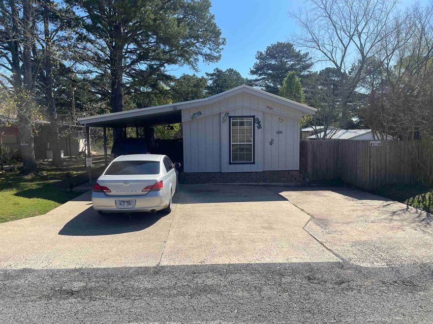 Located in Fairfield Bay this property sits on two lots.  It has 3 outside storage buildings and a covered detached parking area in the oversized back yard.  Close to Fairfield Bay Marina.                                                                                                                                                                                                                          SEE AGENT REMARKS