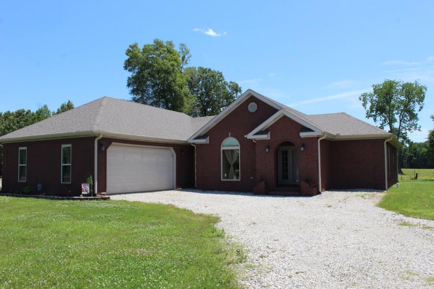 New Roof! New Flooring! New Paint! Newer HVAC With 5 Year Warranty! This stunning 2-acre property features a beautifully designed 3-bedroom, 2-bathroom home with a spacious 2,081 square feet of living space.The Master bedroom boast a nice walk in closet. Handicap accessible bathroom, walk in shower with a seat. Plenty of cabinet space in the kitchen and all new flooring and fixtures. Mudroom as well as a 2 car garage. Next to the house is a 60' X 80' concrete slab ready for use, all overlooking a beautiful pond so schedule a tour today. One year home warranty paid by seller!