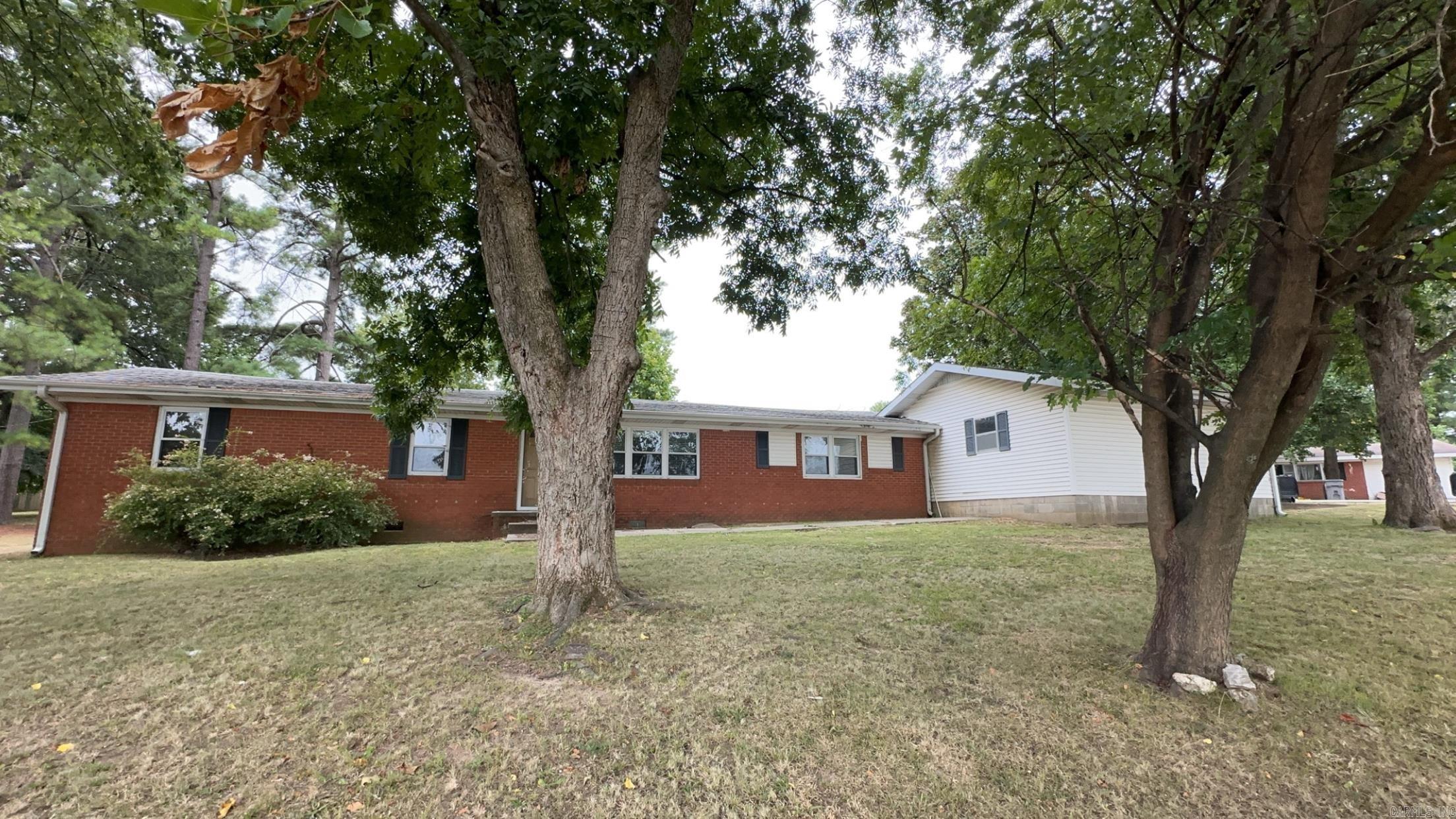Brick home on corner lot, with mature trees. Approximately 1625 sq. ft., most of the house has original hardwood floors, newer windows, but does need several updates.
