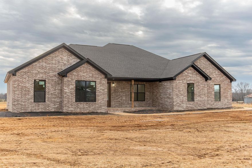 Sitting on 2.77 rural acres, this new construction is ready for you to move in and make it yours! The open floor plan features 4 bedrooms and 2.5 bathrooms. The primary closet is connected to the laundry room! The bathrooms feature stunning tile work and the kitchen features an abundance of quartz countertops, storage and pantry! Enjoy looking out to the back of your property from your window above the kitchen sink. The floors are LVP throughout. Cozy up next to the gas fireplace this winter and enjoy your rural view from your back porch! This home has natural gas and is on city sewer. This property is conveniently located between Russellville, Conway and Little Rock - with easy access to I-40. Enjoy living at the base of Petit Jean Mountain and hiking the trails in the state park on the weekend. *Fiber Internet Available Here* This home is also listed with additional acreage - see mls #24010752. *Taxes were valued on vacant land and will increase.