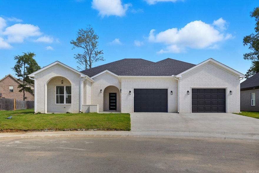 Welcome to this fabulous new construction home with a modern design in The Woods of Hurricane Lake Estates. It features a split floor plan with a vaulted ceiling in the living room, enhancing the spaciousness of the area. A cozy fireplace complements the living space, while large windows allow for abundant natural light. The open floor plan seamlessly connects the kitchen and living room, perfect for entertaining. The master suite is a highlight, featuring a spacious bedroom and your own spa retreat and walk-in closet. Three additional bedrooms, along with two added bathrooms, a mudroom, and large laundry room complete this home.
