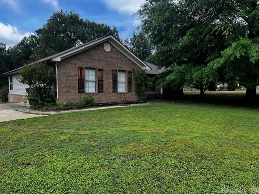 Space for you, space for the kiddos, space for your dogs or a horse!!!!  This 4 bdrm 3 full bath house sits on an acre just outside Searcy and seller tells me this is a wonderful neighborhood.  House is all electric, the garage has been transformed into a 4th bdrm that was used  as an "in-laws" suite with a walk in shower in the bathroom. . New commercial grade tile floors when the house was remodeled in 2018, kitchen updated with a farm sink and subway tile and quartz countertops and stainless appliances. This home is spacious and inviting.  There is a cozy office space with a reading nook/sunroom on the back of the house which opens to a large deck and backyard that includes flower/garden beds, apple trees and a premier basketball court.  There are two BEB storage buildings,   so, there is lots of storage inside and out!  Lots of possibilities with this property!  Call for your showing!  More pictures coming.