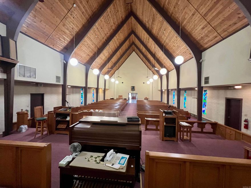 Previous church facility. Any use allowed by seller, check with city planning commission. Almost 12k square ft facility on 2 acres. Approximate 4500 SF sanctuary with lights, fans, pews, organ and sound system.  Approximate 715 SF full kitchen with sinks, ventahood, stove, appliances.  Appointed offices, classrooms, storage closets, and fellowship hall.  4 restrooms. Asphalt parking. Property being sold as-is present condition. All showings must be accompanied by a Realtor. NO Disclosures provided by seller. Existing personal property will remain but will not be considered part of the sale.  Any items left in the building will be considered as-is and abandoned and will have zero value.  Seller makes no guarantees, warranties, or representations of any kind regarding the existence, condition, or usability of said personal property which will remain in building at closing. Title transferred by Special Warranty Deed/Trustee Deed.