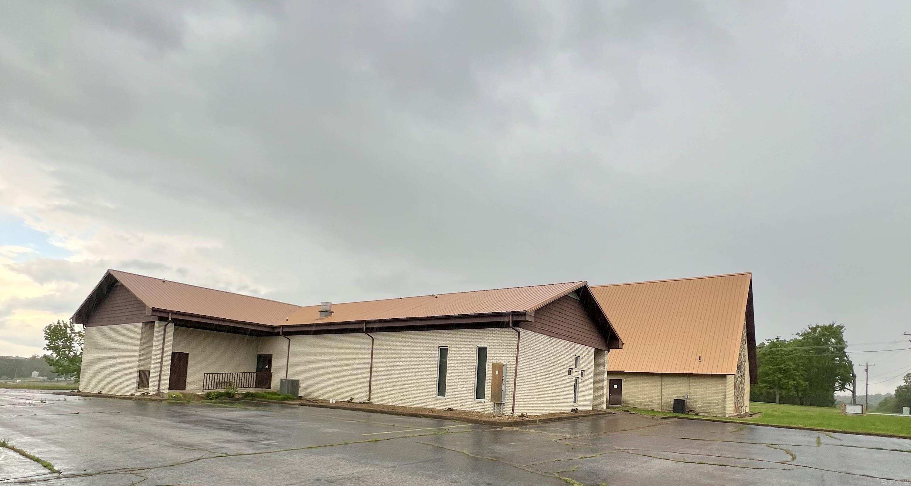 Previous church facility. Any use allowed by seller, check with city planning commission. Almost 12k square ft facility on 2 acres. Approximate 4500 SF sanctuary with lights, fans, pews, organ and sound system. Approximate 715 SF full kitchen with sinks, ventahood, stove, appliances. Appointed offices, classrooms, storage closets, and fellowship hall. 4 restrooms. Asphalt parking. Property being sold as-is present condition. All showings must be accompanied by a Realtor. NO Disclosures provided by seller. Existing personal property will remain but will not be considered part of the sale. Any items left in the building will be considered as-is and abandoned and will have zero value. Seller makes no guarantees, warranties, or representations of any kind regarding the existence, condition, or usability of said personal property which will remain in building at closing. Title transferred by Special Warranty Deed/Trustee Deed.