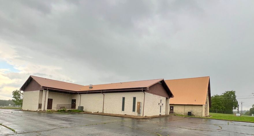 Previous church facility. Any use allowed by seller, check with city planning commission. Almost 12k square ft facility on 2 acres. Approximate 4500 SF sanctuary with lights, fans, pews, organ and sound system.  Approximate 715 SF full kitchen with sinks, ventahood, stove, appliances.  Appointed offices, classrooms, storage closets, and fellowship hall.  4 restrooms. Asphalt parking. Property being sold as-is present condition. All showings must be accompanied by a Realtor. NO Disclosures provided by seller. Existing personal property will remain but will not be considered part of the sale.  Any items left in the building will be considered as-is and abandoned and will have zero value.  Seller makes no guarantees, warranties, or representations of any kind regarding the existence, condition, or usability of said personal property which will remain in building at closing. Title transferred by Special Warranty Deed/Trustee Deed.