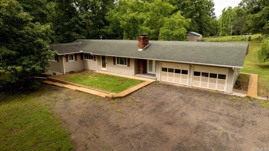 Discover this completely remodeled, five-bedroom, three-bathroom gem with a fully finished walkout basement, nestled on 7 acres just outside the city limits of Mammoth Spring, AR. This gorgeous home is conveniently located within five minutes of town, offering easy access to all amenities. This stunning property boasts a large yard, perfect for gardening and outdoor activities. Inside, you'll find new vinyl plank flooring, fresh drywall, and paint throughout. The brand-new kitchen and oversized laundry room/pantry with custom countertops add modern touches. The entryway features a custom hall tree and staircase railing, adding a touch of elegance. Enjoy the warmth of two large wood-burning fireplaces, one located in the upstairs living room and the other in the expansive downstairs family room. The basement also includes a kitchenette, two bedrooms, a bathroom, and a mechanics room with a tankless water heater and extra storage space, making it an ideal mother-in-law suite. The property is perfect for hobby farming or homesteading, with a pole barn, two chicken barns, and a feed storage building, all equipped with electricity.