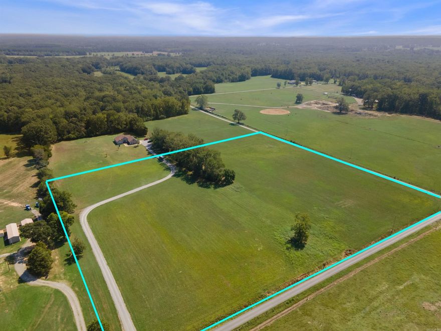 Here is your chance at over 12 acres on a corner lot. There is a drive way that cuts through the property but there are plenty of home sites to choose from! Currently the land is used for "growin', cutting' and bailin'". There is water and electric at the road for utilities. Come see if this property ise a good fit for you and your future dream home!
