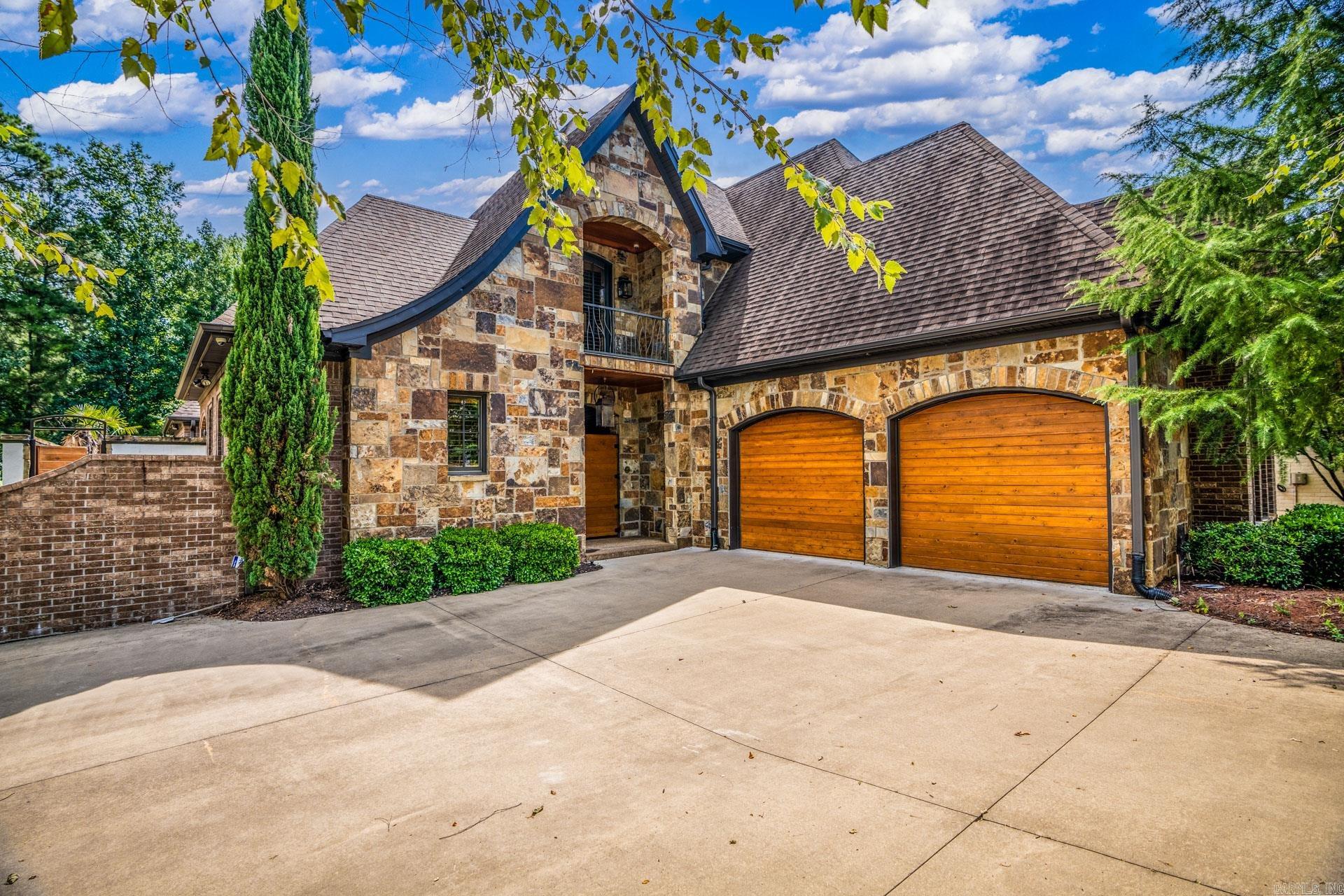 This rare find is a beautiful two story home in the gated neighborhood of Hickory Grove and it has it all! Features include a private courtyard, covered patio, stonewall fireplace, waterfall feature and salt water pool! Inside features large picture windows, in-law quarters, gorgeous custom kitchen, a main-floor master suite with custom bathroom, and so much more!