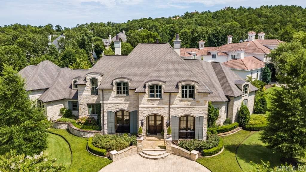 Timeless elegance & attention to detail thru-out this stunning custom hm in Valley Falls Estates. Stone accented kitchen w/large dbl granite island, top of the line Viking appliances, wet bar w/carved surround & 2nd prep kitchen. Wood beamed ceilings, site finished HDWD floors & plaster walls accent the Great Rm, Formal Dining & Hearth Rms. Handsome study w/custom bookshelves. Master ste w/huge closet & gorgeous stone bath. Guest BDRM suites up w/Bonus living. Sculptured gardens & outdoor living. Come see!