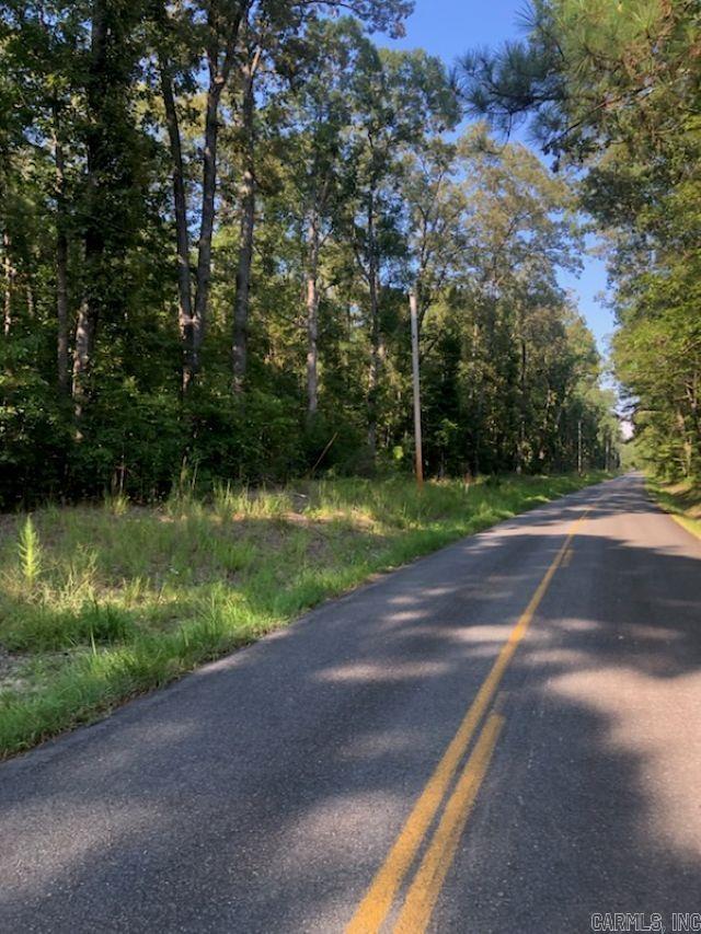 A beautiful timbered tract of land with over 1300 feet of paved rod frontage. Good level land with a small creek on the NW corner.