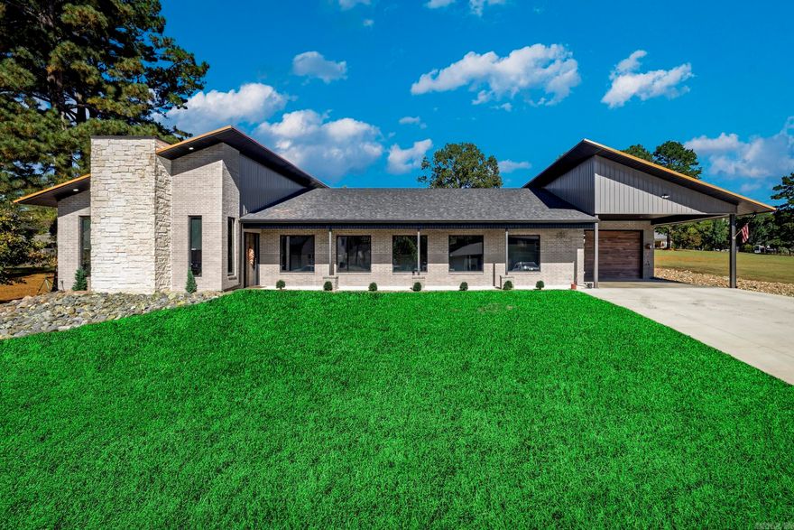 Step into modern luxury with this stunning 3-bedroom, 3-bath home built in 2023 and located within the highly desired Lakeside School District. The open-concept living room showcases tall ceilings, a sleek stone fireplace, and abundant natural light, creating a warm and inviting atmosphere. The chef’s kitchen is designed to impress with rich wood cabinetry, premium stainless appliances, and a massive island perfect for entertaining. The primary suite offers a spa-like retreat with an oversized walk-in shower, dual rainfall showerheads, and a double vanity. Area amenities include Lake Hamilton boat access.   Enjoy the best of Arkansas outdoor living on the covered back patio—complete with a built-in grill station, seating area, and TV setup overlooking a private, fenced yard ideal for kids or pets. A highlight of this property is the fully finished shop space, perfect for hobbies, a home gym, or small business use.  Set in one of Hot Springs’ most sought-after areas, this home offers convenience to shopping, dining, and Lake Hamilton recreation while providing the tranquility of suburban living.