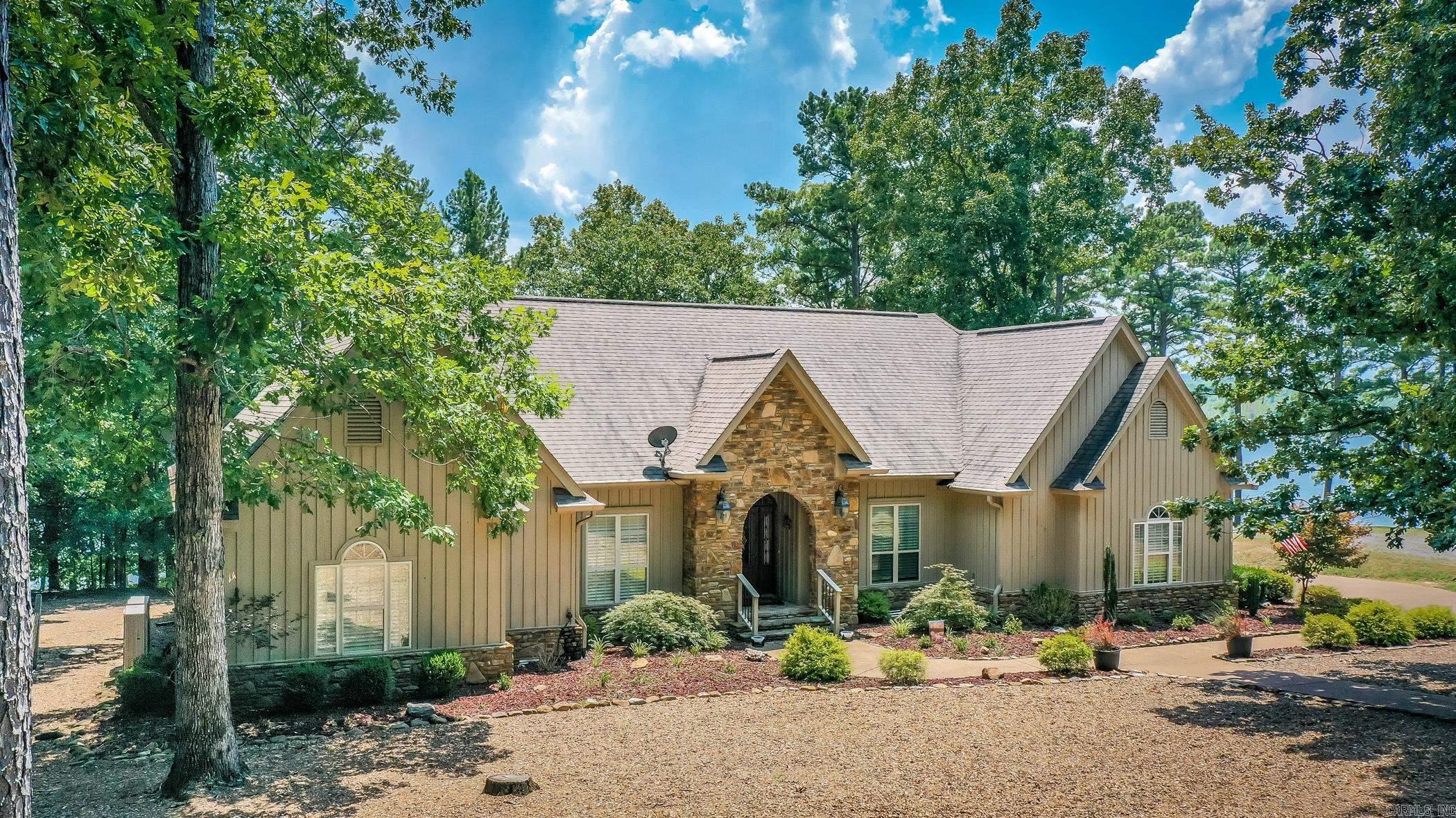 Welcome to your FURNISHED dream lakefront home nestled in the picturesque community of Grand Isle. This property boasts a perfect blend of natural beauty, offering breathtaking views of the serene lake. With its stone fireplace, vaulted ceilings, & a host of other exceptional features, this residence promises an unparalleled living experience. Imagine cozying up by the fireplace on chilly evenings, creating memories with loved ones. The kitchen is equipped with newer appliances. The den offers a peaceful retreat overlooking the tranquil lake, where you can relax & unwind while immersing yourself in the beauty of nature. One of the highlights of this remarkable property is the screened room that provides an idyllic setting for enjoying the breathtaking lake views. The expansive deck overlooks the glistening lake, offering ample space for entertaining guests. The master suite is a true oasis, featuring an updated master bath with a custom shower. Indulge in the ultimate relaxation as you pamper yourself in this luxurious space. Every detail has been carefully curated to create a sanctuary where you can escape the stresses of everyday life. New HVAC. A boat slip is available $35,000