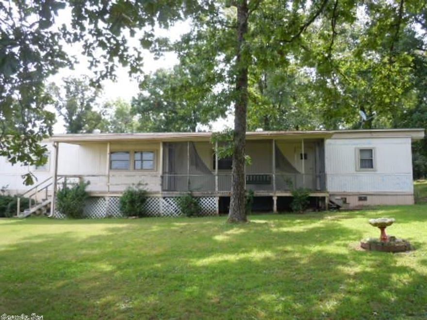 VERY NICE CLEAN 3 bedroom 2 bath Mobile Home. 1 Bedroom on opposite end. Kitchen & dining room nice size. Newer A/C, Heater, Carpets, windows, water softner and stove/range. Shed under carport. Propane tank owned and will convey with the property.