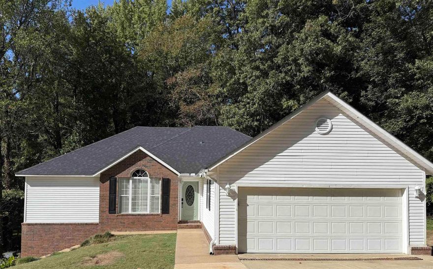 Welcome Home to 1268 Wade Ave in Piggott, AR-a peaceful retreat tucked away close to Sugar Creek Country Club on a quiet street.  This 3 bedroom, 2 bath home, offers plenty of space with 1645 sq ft upstairs plus 518 sq ft walkout basement for extra living or storage space.   Step outside onto the two-tiered deck overlooking the tranquil backyard where you can relax, unwind, or cookout and enjoy the sights and sounds of local wildlife. Inside, you'll love the bright, comfortable feel with plantation shutters, a separate dining area, and new appliances that stay with the home.   The primary suite is a true highlight, featuring a brand new tiled beautiful shower and soaking tub combo, plus double sinks for extra convenience. Major updates give you peace of mind, including new roof and water heater (both just 6 months old).  Close to local amenities , medical facilities, and everything Piggott has to offer , this home is the perfect mix of comfort, charm, and convenience. Come see why life in beautiful Northeast Arkansa is so easy to love!