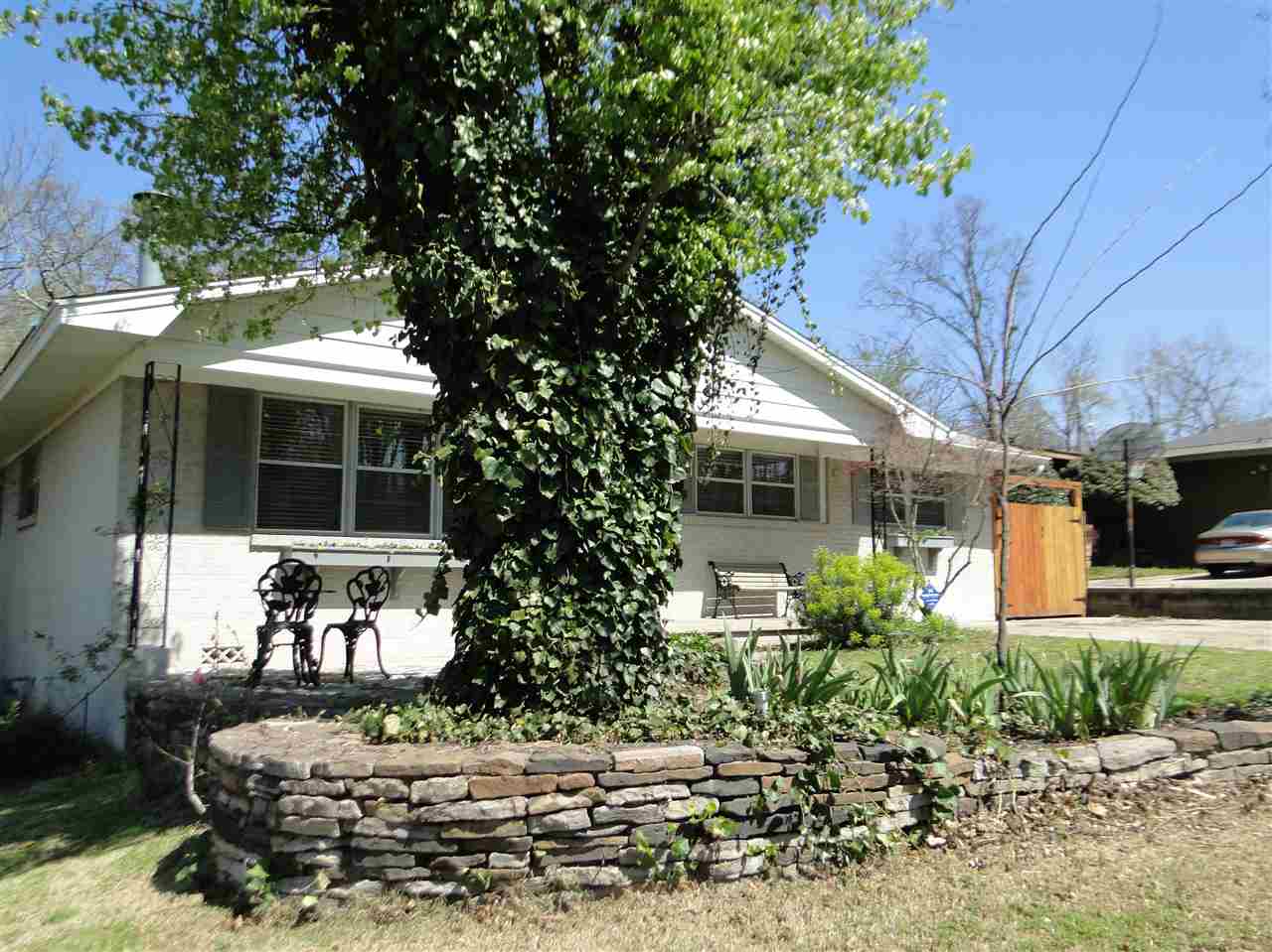 This Hillcrest home is filled with an abundance of updates inside & out.The spacious family room has gas log fireplace flanked by nice built cabinets. hardwood flooring in living room, 2 BR & office. Tiled floors and counters in the cheerful eat-in kitchen with gas range, dishwasher & built in hutch. Off the kitchen is either a master suite or currently being used as an office. The outdoor living space is enormous with new composite decking, cedar fence and custom river rock patio with fire pit. Much more!