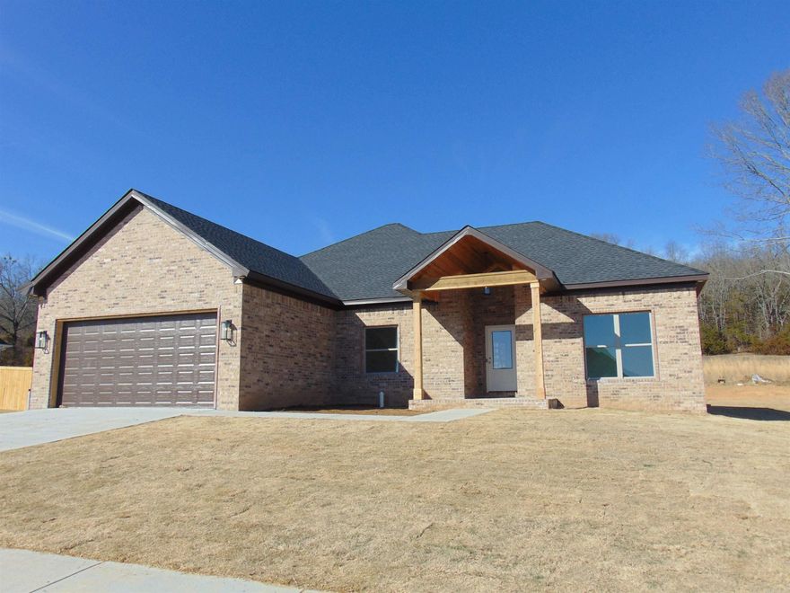 This magnificent 4 bedroom, 2 bath NEW CONSTRUCTION is nearing completion.  Quality and attention to detail makes this one exceptional.  Open floor plan.  Beautiful crown molding and all windows trimmed.  Custom cabinets in kitchen & baths.  Brick front porch with tongue and groove ceiling.  Spacious family room open to kitchen with large breakfast bar, stainless steel appliances, gas stove, microwave, under counter lighting, quartz countertops, tile backsplash, pantry and nice size breakfast area. 10' ceiling in main living area and 9' in other areas.  Luxury vinyl flooring throughout.  Primary bedroom separate from other 3.  Primary bath has tile shower plus tub.  Huge, covered patio with tongue and groove vaulted ceiling overlooks private backyard, perfect for relaxing or entertaining.  Large lot, accent lighting in eaves, gutters, partially fenced.  This one is truly special! A MUST SEE!!