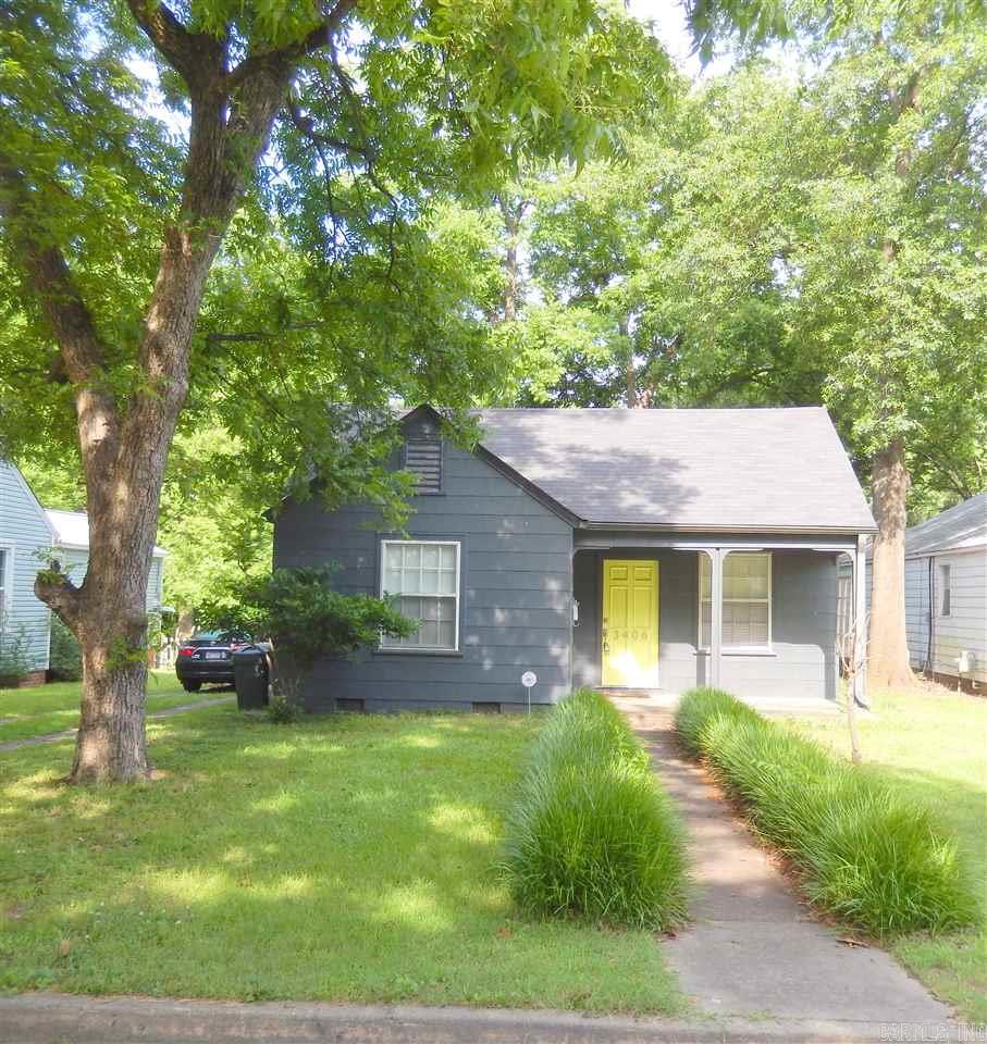 Come see this Charming home/bungalow in the Historic District of Park Hill that sits on a level lot. This one features hard wood flooring, dinning room, 2 nice size bedrooms and a remodeled bathroom. The cook of the house will love the cute kitchen. Spacious laundry room with built in desk and closet that could be used as a office. Detached garage with electric and water serves as extra storage but could converted back as a garage. The deck that overlooks the large back yard is perfect for outdoor cook outs