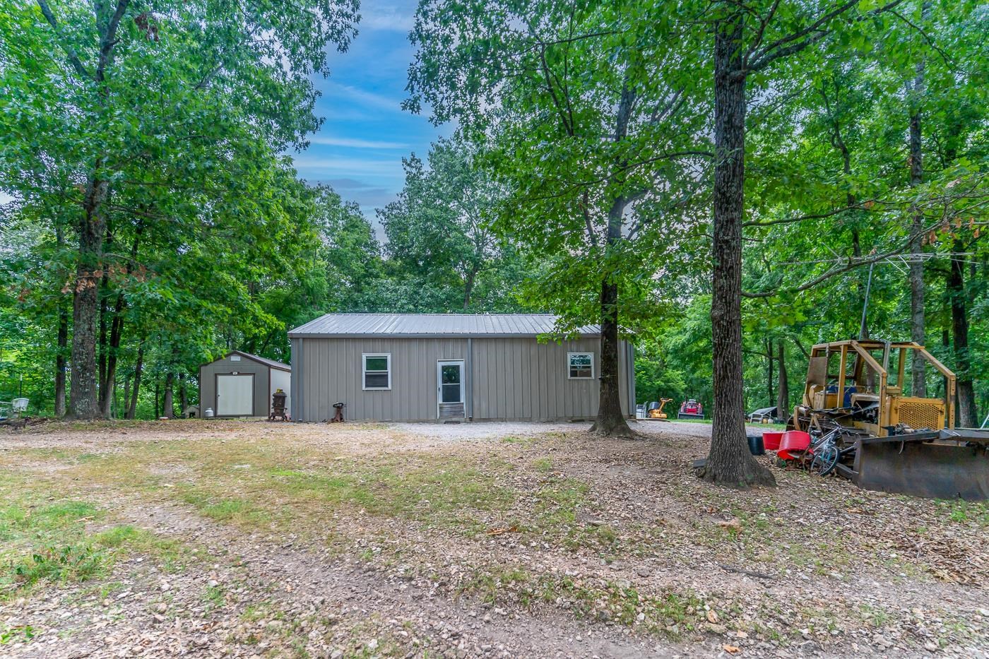 Welcome to Market 3000 Collietown Rd of Batesville, Arkansas containing 2 surveyed adjoining parcels in Independence & Izard counties. Nestled on 36.75 wooded & rolling acres is a 2016 built 1,340 sf Barndominium wrapped in metal, and topped with a metal roof. The well laid out interior features an open concept kitchen/dining/living room area, 2 bedrooms, 1 bathroom, and utility/storage room. The exterior features a 10x20 Bald Eagle Barn, 2 patio slabs, deer stand, and frog pond. The Sellers love the seasonal views of the majestic White River which is internationally known as a premier trout and fly-fishing destination, mature timber including: Oak, Walnut, Cedar, and Pecan, Plants such as: Blackberry, Mushrooms, and Onion, hunting/fishing opportunities, wildlife watching, good cell service, well, internet, and electric on site, raising livestock of goats and chickens, the Volunteer Fire Department, and the Hunting Club that is just North of the property. Conveniently located near Cushman, Batesville, and Cave City. Opportunity knocks. Properties like this are few and far between. Call today to make an investment in tomorrow and lay claim on this hidden gem in The Natural State.