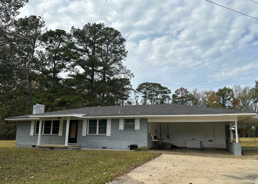 There one has little something for everyone.  Sitting on 4.69 acres.  The main house is 1528 square feet with three bedrooms and two bathrooms.  Great jetted tub in the primary bathroom. Kitchen and dining room combo with a nice pantry/coffee bar area.  Living room is spacious with a wood burning fireplace. (It is currently not being used) One of the bedrooms has sliding doors out to the backyard.  Great shop area with tons of space!  Also, there is a "mother-in-law" 20 x 20 separate building. (separate septic and electricity) It includes a one bedroom on bath, small kitchen and living room.  12 x 18 barn with lean to sits at the back of the property, plus a 14 x 16 storage building.  This one you really have to see for all its potential and what it offers!