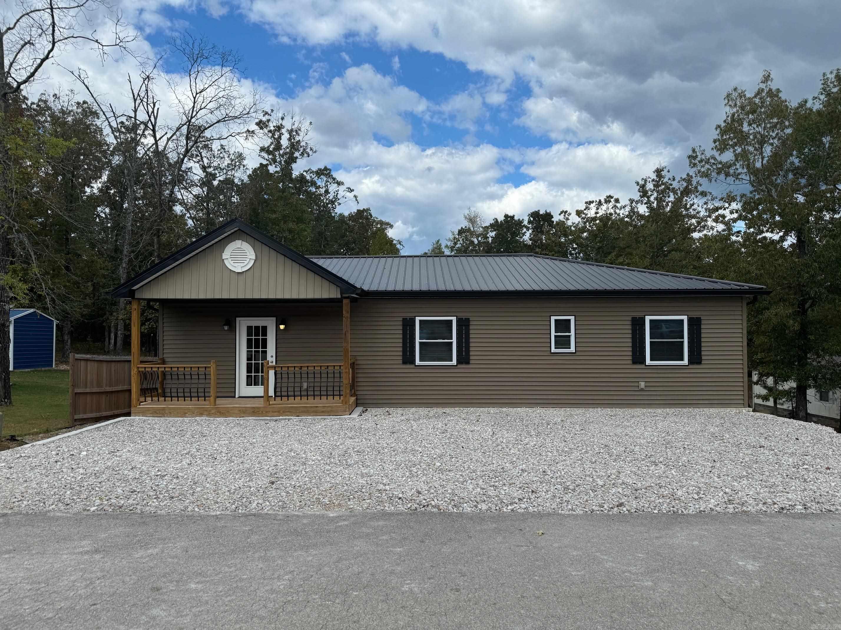 Three bedroom 2 bath home with 30 x 50 shop. Rare find in Fountain Lake School District, large lot, metal roof, tile floors. Rural neighborhood with Central Arkansas Water and sewer. Fiber internet available. Square footage based on original plans, feel free to measure.