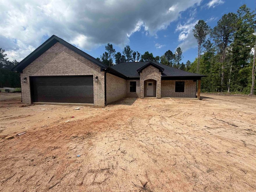 Welcome to this beautiful all brick home offering 3 bedrooms, 2 bathrooms, plus a small dedicated office, perfectly designed with comfort and functionality in mind. Situated on 2.18 acres, this property provides the ideal blend of space, privacy, and modern living. When you step inside you'll find an inviting open concept layout featuring a cozy gas fireplace and the spacious kitchen includes a large pantry with plenty of storage, making organization effortless. Just off the garage entry, you'll love the convenient mud room complete with built-ins for everyday storage needs. The private primary suite is a true retreat with a spa-like bathroom featuring a beautiful walk-in shower, soaking tub, double vanities, and an oversized walk-in closet. With thoughtful details throughout and plenty of outdoor space to enjoy, this home offers everything you've been looking for! Schedule your showing today!!